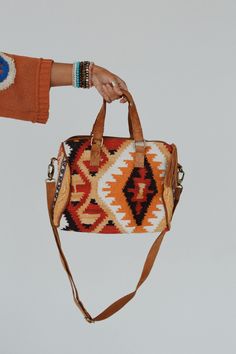 Get ready to receive all of the compliments with the boho statement Nomads Dream Handwoven Bag. Perfect for all your boho-chic and stylish adventures! So cool multi-color fabric with a boho-inspired design throughout So CUTE Cotton weekender style bag Adjustable shoulder and side straps Inside zipper pocket and slip pockets Fully lined interior Pair with: Eye Of The Sun Padded Bralette, Ethereal Shine Stacked Bracelet and Dreamscape Layered Necklace. *Due to lighting and differences in monitors, Boho Essentials, Ready To Receive, Handwoven Bag, Bralette Outfit, Three Bird Nest, Padded Bralette, Heart Bag, Color Fabric, Layered Necklace