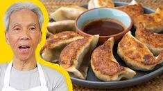 an older man standing in front of a plate of food with dipping sauce on it