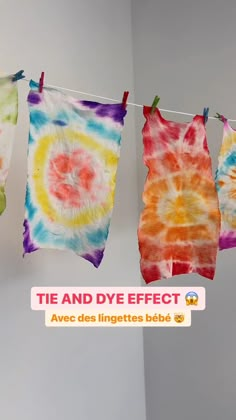 tie - dyed shirts hanging on a clothes line with the words tie and dye effect