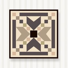 a wall hanging on the side of a white wall with a black and brown pattern