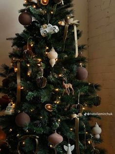 a christmas tree decorated with ornaments and lights