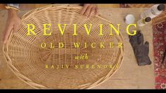 an old wicker basket with the words revving on it and someone's hands