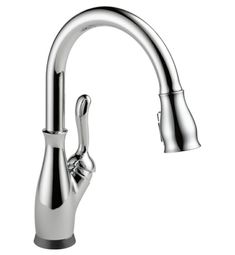 a chrome sink faucet with the pull out spout and side sprayer