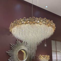 a chandelier hanging from the ceiling in a room with purple walls and flooring