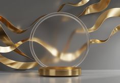 a glass and gold object on a white surface with wavy lines in the back ground