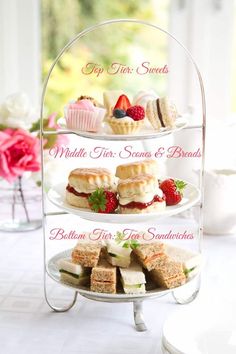 three tiered trays filled with pastries and desserts