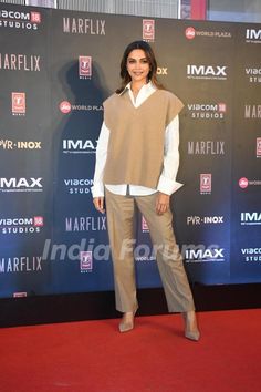 an image of a woman standing on the red carpet at a film awards event in mexico