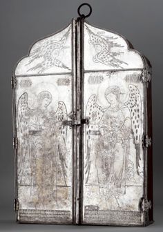 an old metal door with pictures on the front and side panels in different styles, including angels