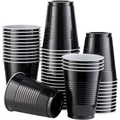 many black and white cups are stacked together