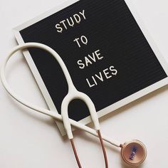 a stethoscope laying on top of a sign that says study to save lives