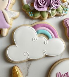 cookies decorated with icing and decorations on a table