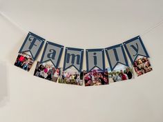 a family banner hanging on the wall with photos and letters that spell out families below it