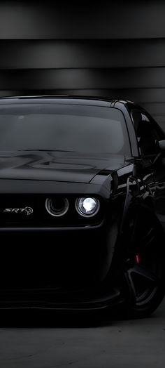 the front end of a black sports car