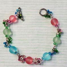 I Have Three Colored Seaglass Beads, Blush Pink, Sea Green, & Sky Blue. All Are Surrounded By The Same Color Sparkle Glass Baby Beads. It Is All Wire Wrapped In Silver With A Beautiful Silver Etched Design Toggle Clasp Closure! Super Cute For You Or A Great Gift To Give!!! Blue Bead Jewelry, Pink Sea, Jewelry Styles, Pretty Beads, Green Sky, Etched Designs, Funky Jewelry, Glass Bracelet, Styles Inspiration