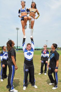 the cheerleaders are doing tricks on their team's aerial acrobatics