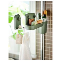 a towel rack with soaps, toothbrushes and other items hanging from it