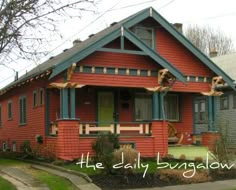 a red and blue house with the words the daily sunglow written in front