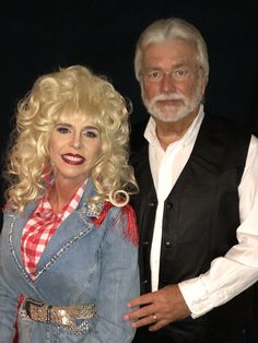 a man standing next to a blonde haired woman