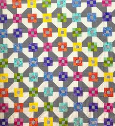 a quilt made with different colored squares