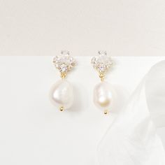 GISELLE // Gold bridal pearl drop earrings - An elegant pair of gold cubic zirconia earrings with clear cz crystals and freshwater pearls on a gold plated finish. Due to their natural form, pearls will vary in size and shape.  Please note, that for hygiene reasons earrings cannot be returned. Bridal Pearl Drop Earrings, 2023 Earrings, Pearl Drop Bridal Earrings, Wedding Earrings Pearl, Gold Wedding Earrings, Bridal Drop Earrings, Pink Jewellery, Pearl Drop Earrings Bridal, Pearl Wedding Earrings