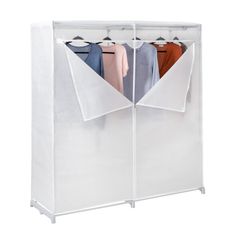 an open white closet with two shirts hanging on the hangers and three folded ones