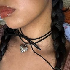 "The Keke Suede String Heart Necklace 🤍 *all photos owned by me!* Featuring a stainless steel puffy heart pendant, and a 48\" cut suede string cord. There are a ton of ways to wear this necklace (you can even wear it as a waist belt!) and if you need a custom length, DM me!  Choose between gold and silver at checkout  Unisex & tarnish proof 🖤 Made with love 🫶" Cute Black Heart-shaped Necklaces, Cute Black Heart Necklace, Cute Black Heart-shaped Necklace, Cute Black Necklace For Valentine's Day, String Heart, Suede Cord Necklace, Necklace String, Puffy Heart Necklace, Necklace Outfit