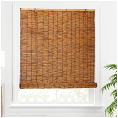 a bamboo blind in front of a window