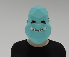 a man wearing a blue mask with teeth on it's face and black t - shirt