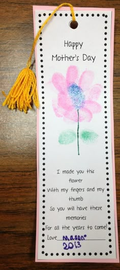 a mother's day card with a flower and tassel on the tag that says, happy mothers day