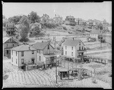 an old black and white photo of some houses