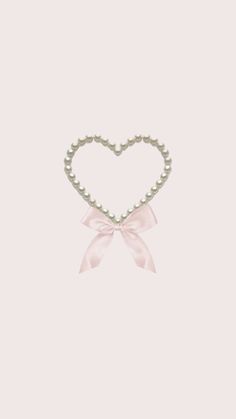 a heart with pearls and a pink bow