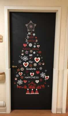 a door decorated with christmas decorations and stickers