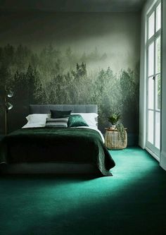 a bedroom with green carpet and wallpaper