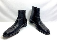 sale 10.00 off with free shipping...was 149.00 now 139.00 VERY HANDSOME FLORSHEIM BOOTS. ALL LEATHER BLACK FLORSHEIM DISCO DRESS BOOTS.  READS A MENS SIZE 12D MADE IN INDIA INSIDE THE BOOTS.  I BELIEVE THESE ARE FROM THE 90's- 2000's. 70's STYLE JOHN TRAVOLTA SATURDAY NIGHT FEVER, ELVIS, THE BEATLES  RETRO DISCO LEATHER BOOTS.  IN EXCELLENT IMPECCABLY CLEAN CONDITION. COUPLE LIGHT CREASES ACROSS THE INSTEPS AND VERY LIGHT NEARLY UNNOTICEABLE SCUFFS.    THE ZIPPERS WORK PERFECTLY AND RUN SMOOTHLY.  GREAT FOR COSPLAY OR EVERYDAY. CONSTRUCTED OF ALL BLACK SHINY LEATHER. INSIDES ARE LINED IN A BLACK LEATHER WITH SIGNATURE FLORSHEIM FOOT BED. HAVE ALL LEATHER SOLES AND STACKED 1.5 INCH LEATHER HEELS WITH RUBBER SIGNATURE FLORSHEIM HEEL CAPS.   THEY HAVE A ROOMY ROUNDED TOE.  COMES FROM A SMOKE Fitted Vintage Boots For Business, Retro Fitted Boots For Formal Occasions, Retro Formal Winter Boots, Vintage Formal Boots For Spring, Retro Fitted Boots With Square Toe, Fitted Retro Boots With Square Toe, John Travolta Saturday Night Fever, Disco Boots, Karl Lagerfeld Fashion