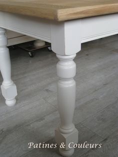 a white table with wooden top and legs