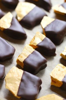 chocolate covered crackers and chips on a baking sheet