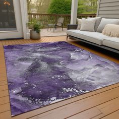 a purple area rug on a wooden deck