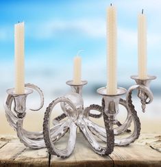 If you're longing to throw the ultimate coastal party, start with a dramatic centerpiece like this one! Light the candles and let this extraordinary candelabrum create a dramatic setting for you and your guests. Crafted from pure pewter, the Deep Sea Denizen holds four taper sockets in its curling and detailed tentacles. You'll be intrigued by the exquisite detail of this piece, which captures the essence of marine life in pure pewter. Every sucker pod on the octopus’s tentacles is perfectly rea Octopus Candle Holder, Beach Candle Holder, Octopus Decor, Pewter Candlesticks, Octopus Gift, Octopus Jewelry, Metal Candelabra, Beach Candle, Octopus Tentacles