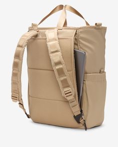 a backpack with an open laptop compartment in the front and side pocket on the back