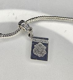 Passport Charm, Foreign Travel Charm, Paris Charm, World Travel Charm, Travel Charm, Dangle Charm, Fits all Designer and European Charm Bracelet Fits Pandora plus all Designer and European charm bracelet, fits snake chain bracelets and necklaces. **Charm: 18x14mm, Bail: 11x6mm  Hole: 4.5mm  Zinc Alloy **Free USA domestic shipping after spending a specific amount (not including tax and shipping).  See shop announcement for free shipping info. **All orders are shipped immediately from Ohio.  If there is an exception to this it will be posted in the shop announcement. Please be sure to review the photos of charm; if there are no measurements in above description please see measurement photos included. Reviewing the photos may prevent dissatisfaction due to size or other aspects of the charm u Foreign Travel, Travel Charms, Bracelet Pandora, Snake Chain Bracelets, Bracelets And Necklaces, Chain Bracelets, Silver Plated Jewelry, World Travel, Dangle Charms