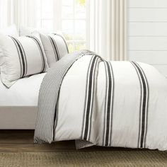 black and white striped bedding in a bedroom