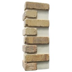 a brick wall mounted to the side of a building with four bricks stacked on it