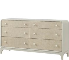 a white dresser with drawers and knobs on it