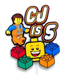 a cake topper with legos on it that says c u is 3 in front of a white background