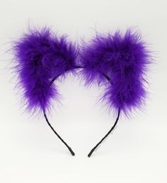 "Are you ready for Halloween? Our Bewitched Fluffs come in the Purrrfect Halloween Purple. These fluffy Cat Ears Headband are the must-have accessory for your Halloween outfit! Get noticed and be ready for lots of compliments with these festive and cute feather kitty ears.  Wear these alone or pair them with our matching Bewitched Puff Chain Drop Earrings! You can also upgrade your ears with LED lights and party the night away! Great for festivals, birthday parties, clubs, raves, bachelorette pa Halloween Cat Ears Hair Accessories For Costume Party, Halloween Costume Party Cat Ears Hair Accessories, Novelty Cat Ears Headband For Costume Party, Cute Halloween Party Headband, Novelty Cat Ears Accessories With Cat Design, Halloween Cat Ears Headband For Costume Party, Adjustable Cat Ears For Halloween, Adjustable Cat Ears Costume Accessories For Halloween, Halloween Party Hair Accessories With Ears