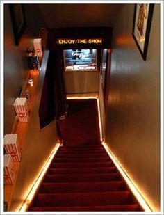 the stairs leading up to an empty movie theater