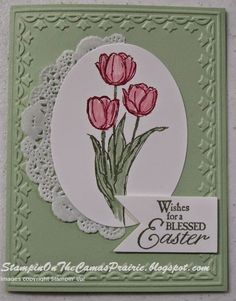 a card with three pink tulips on it