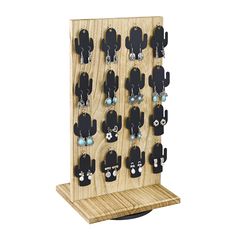 a wooden rack with earrings hanging from it