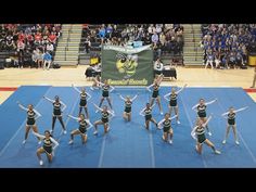 a group of cheerleaders perform on the court