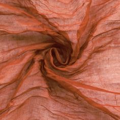 an orange colored fabric with very thin lines on the top and bottom, as seen from above